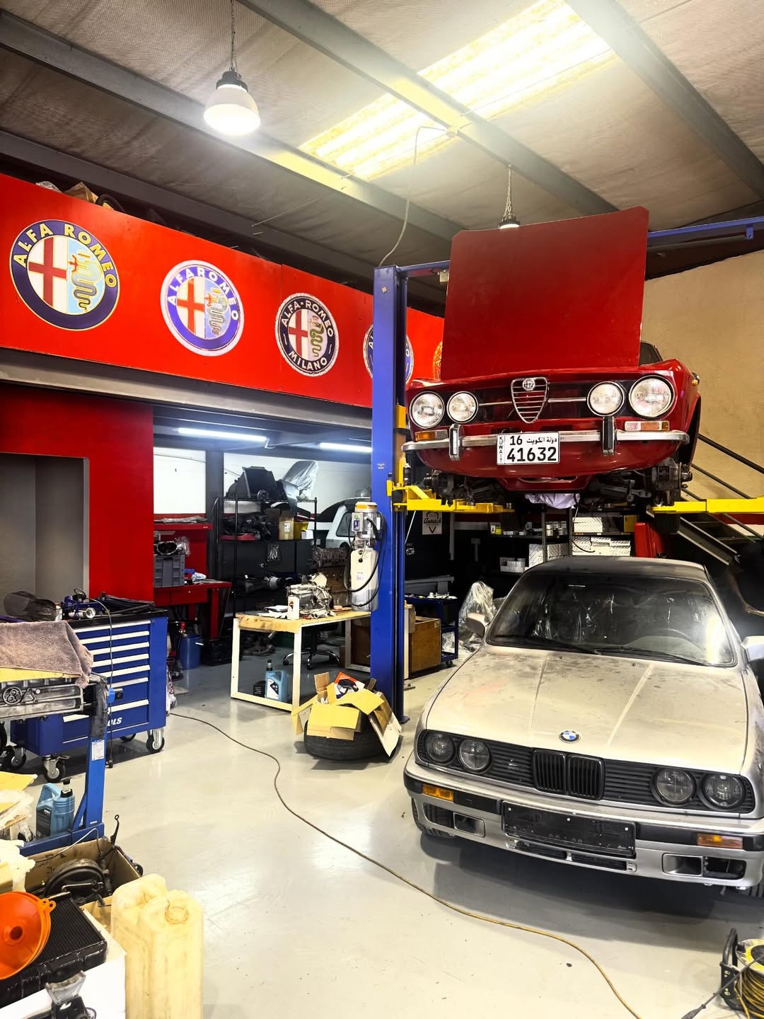 Autotech workshop floor with Alfa Romeos in for specialist service